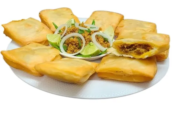 Lukmi, crisp pastry squares filled with spiced mince